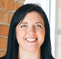 Customer support head Sophie Hartwell, leading the service team, portrait